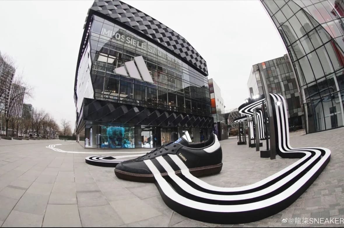Giant black Adidas Samba and flowing Three Stripes installation outside the Beijing store