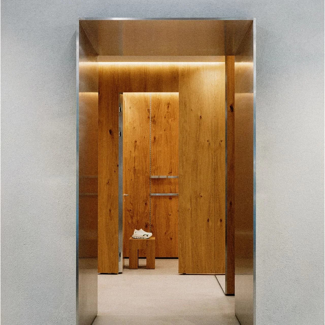 On Vienna store entrance with wood paneling and shoe display