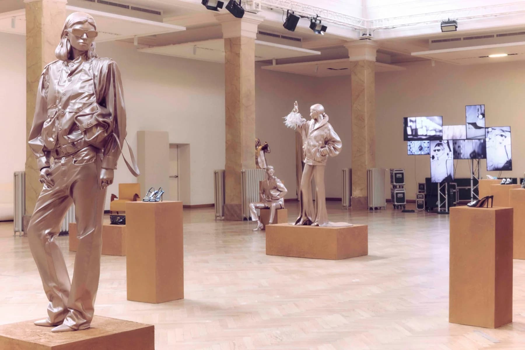 Jimmy Choo Spring 2027 presentation with metallic sculptures and shoes displayed on plinths