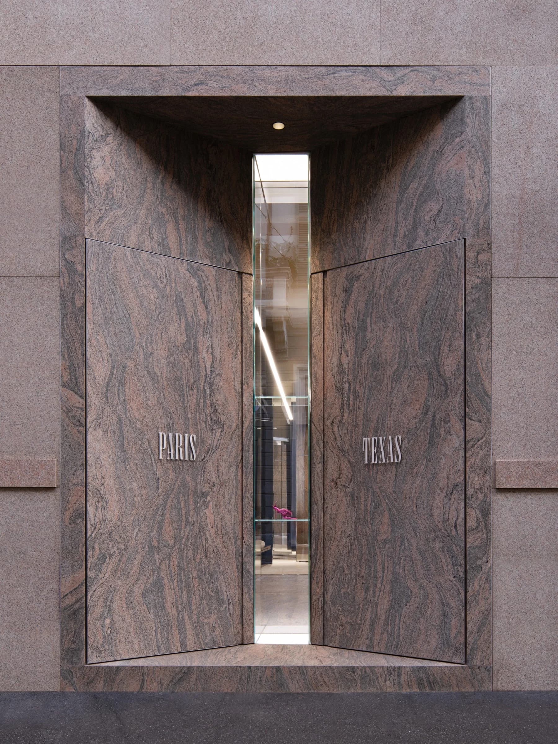 Stone-clad entrance to the first Paris Texas store in Milan
