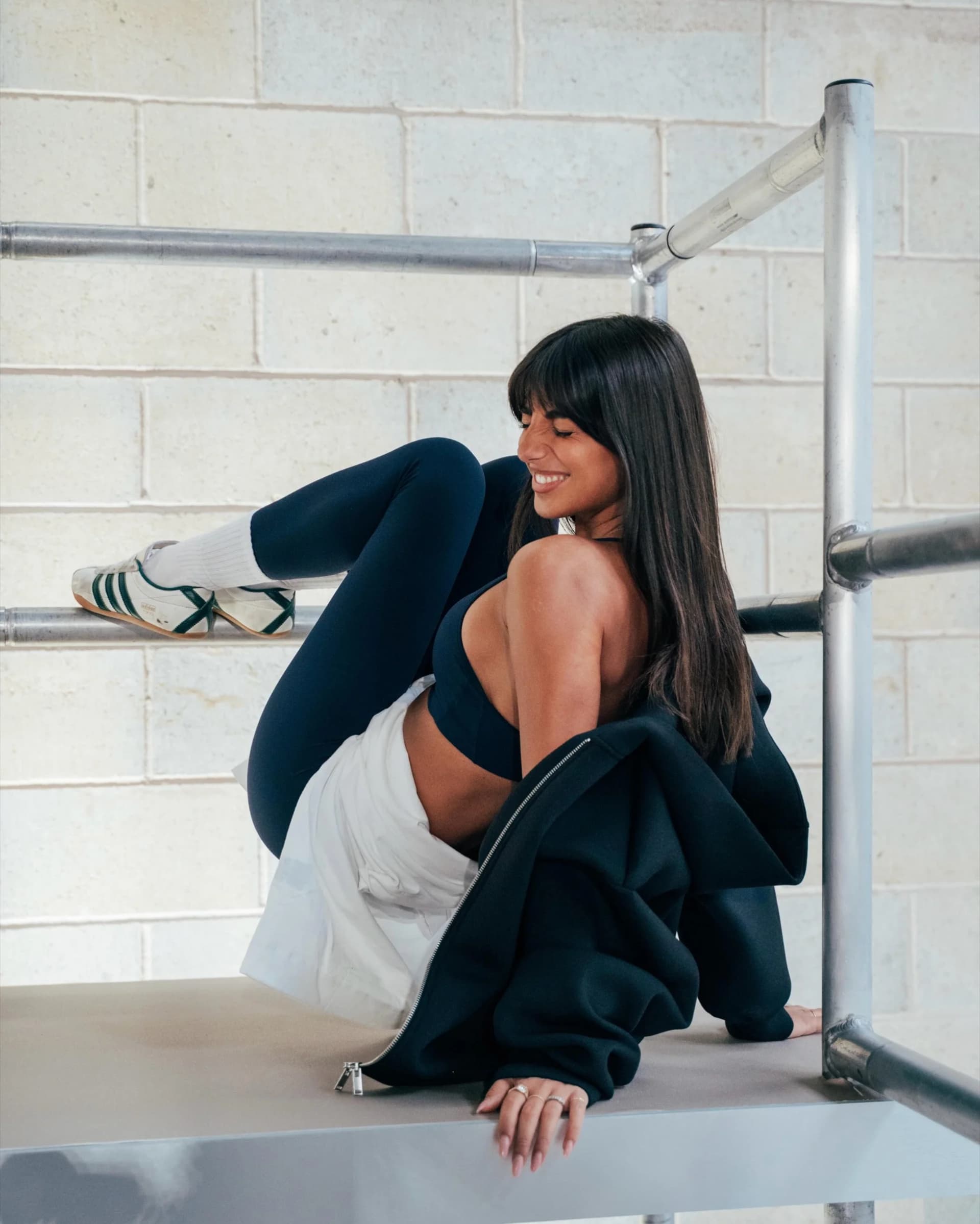 H&M Move event attendee in black training apparel in a gym setting
