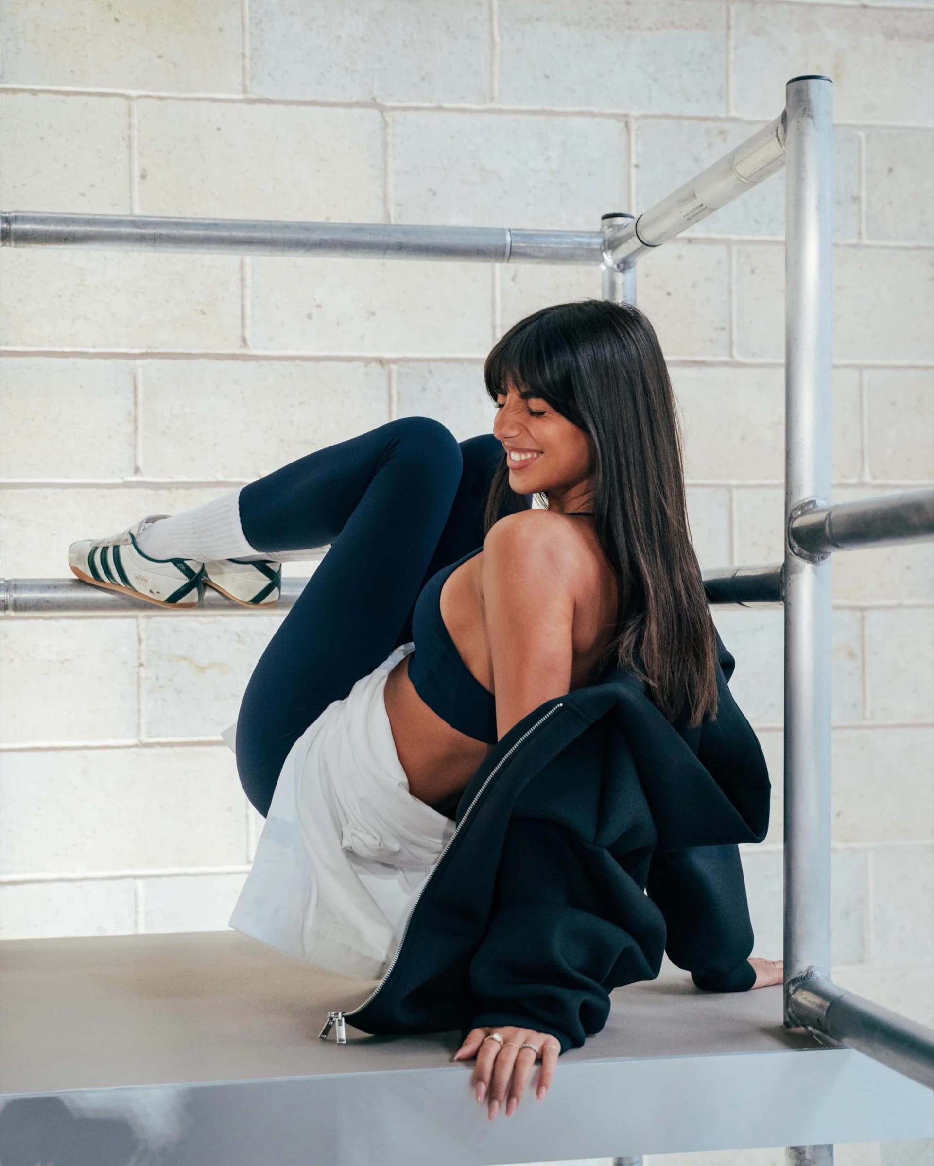 H&M Move event attendee in black training apparel in a gym setting