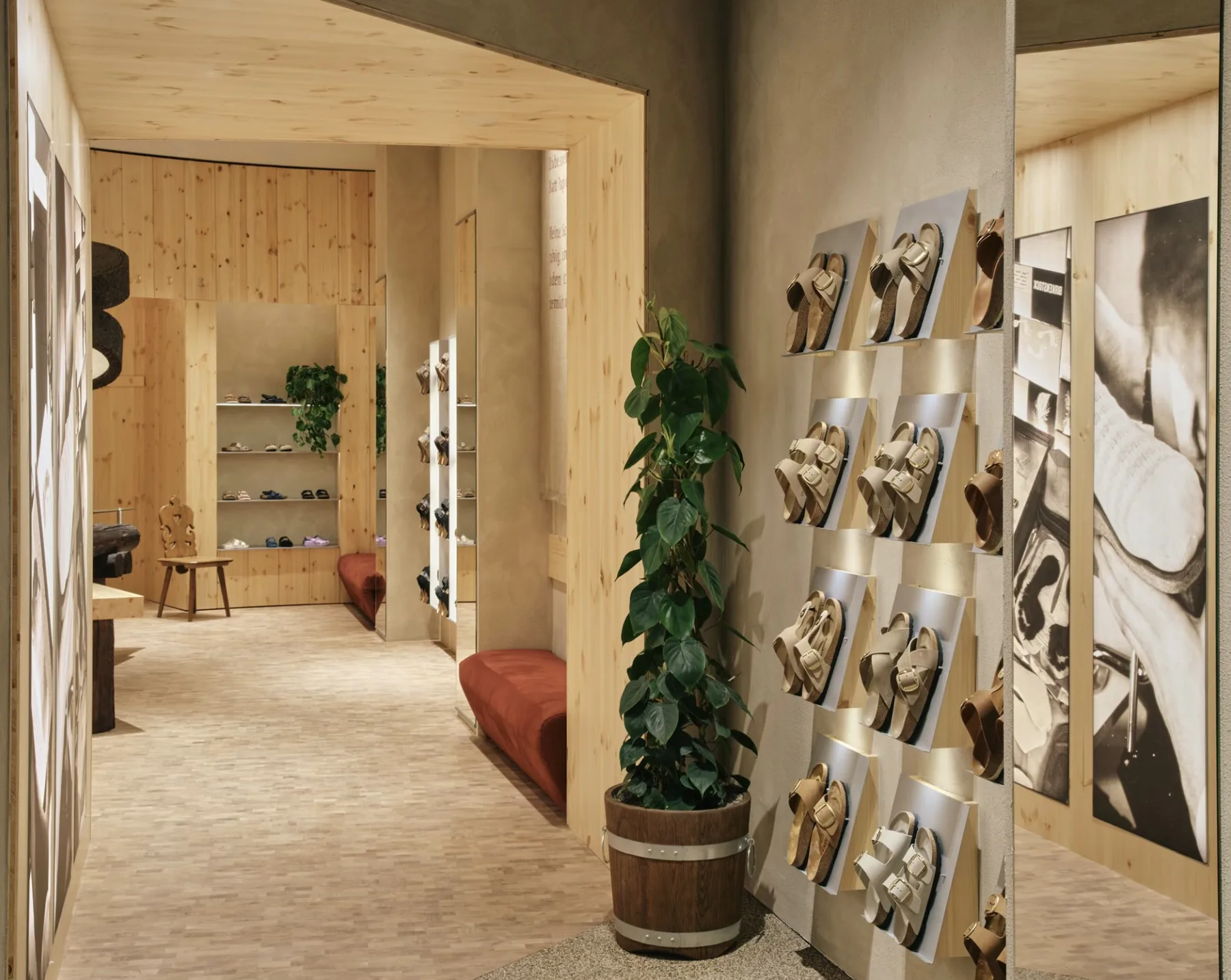 Birkenstock Zurich store wall displaying sandals among light wood and greenery