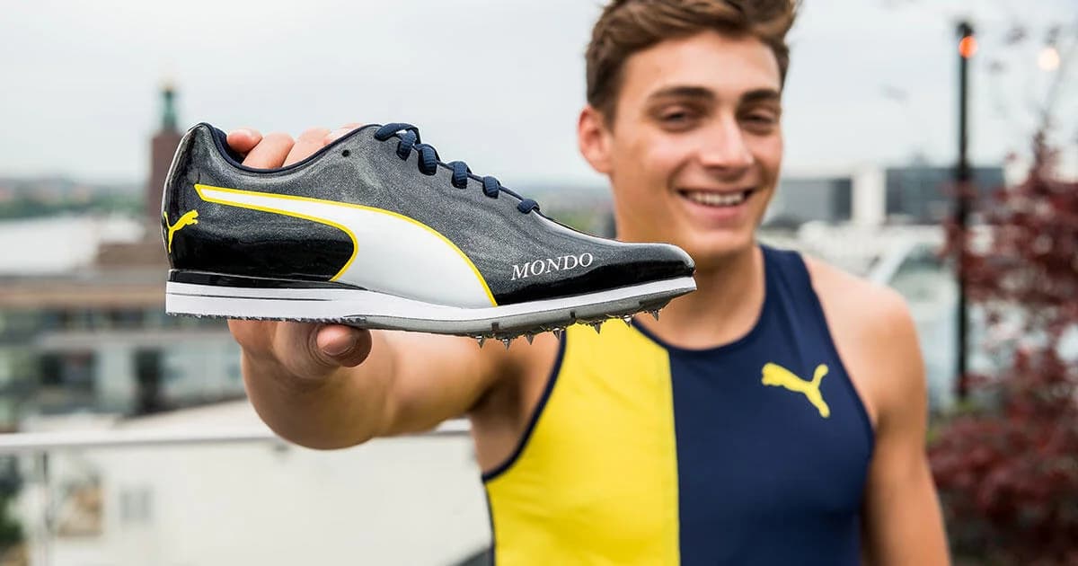 Mondo Duplantis holding a PUMA pole-vault spike marked with his name
