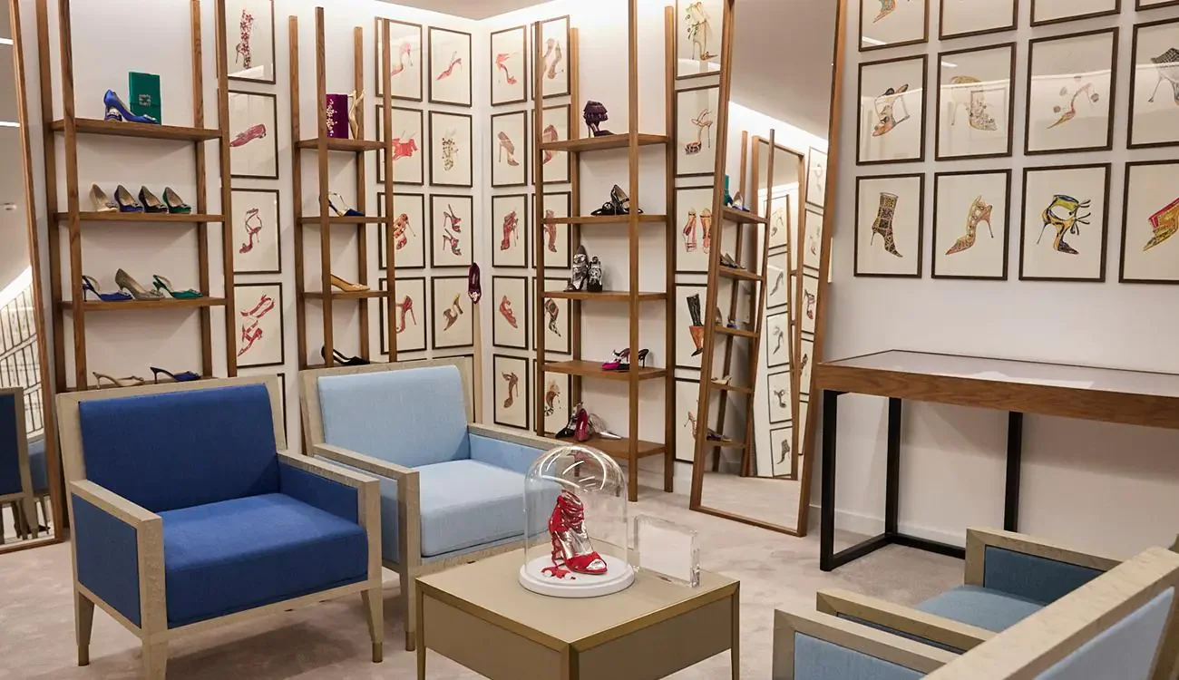 Interior of Manolo Blahnik's new Harrods boutique with shoe sketches and seating