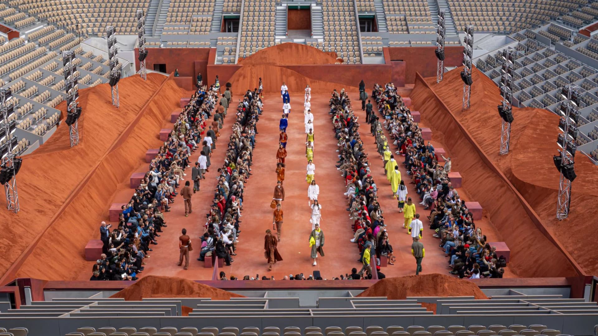 Models circle the clay court at Lacoste's Spring Summer 2027 runway show
