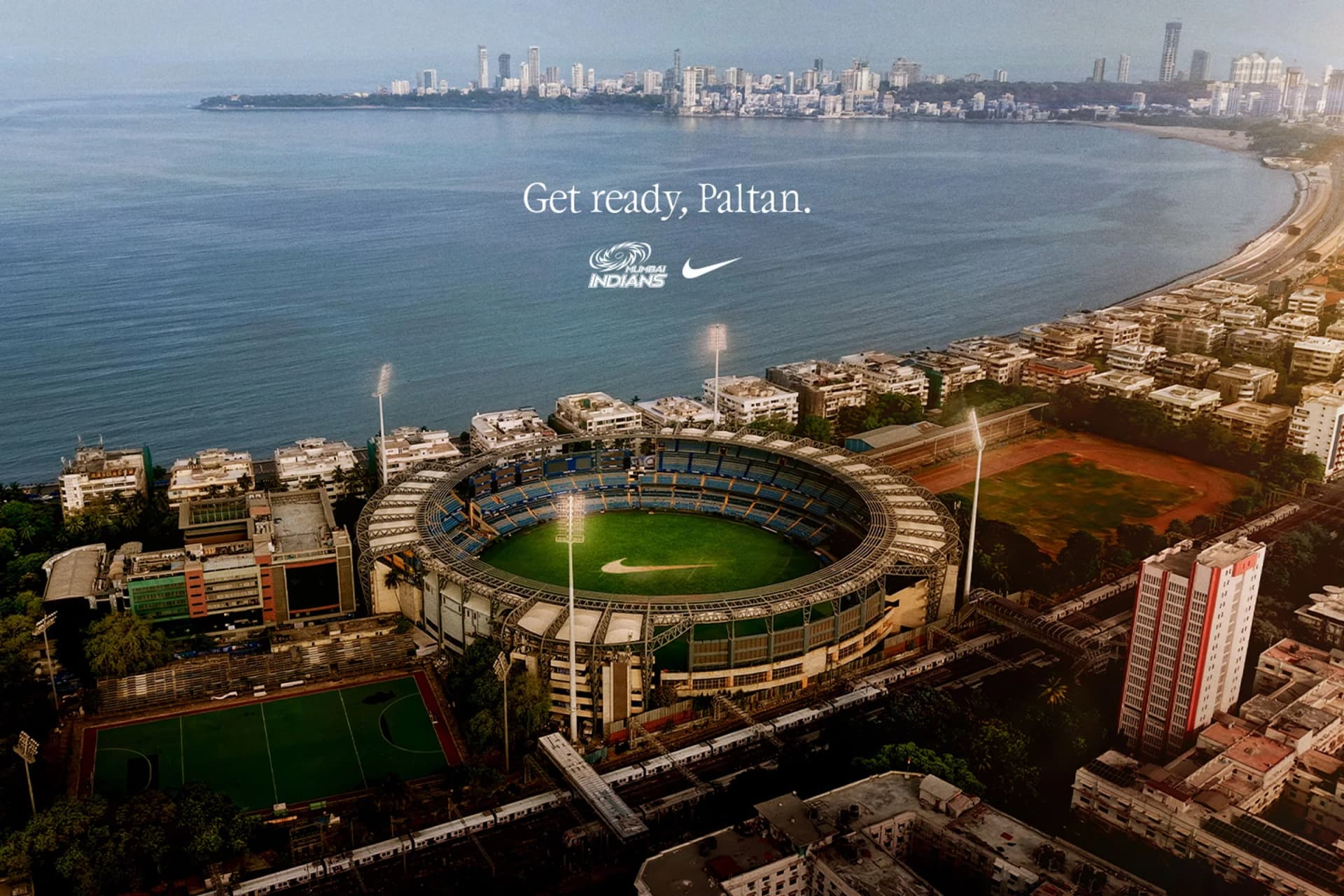 Nike and Mumbai Indians partnership campaign image showing Wankhede Stadium and the Mumbai waterfront