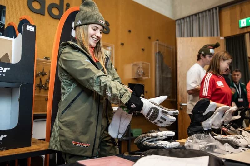 Athlete tries on ski gloves during adidas and German Ski Federation outfit days