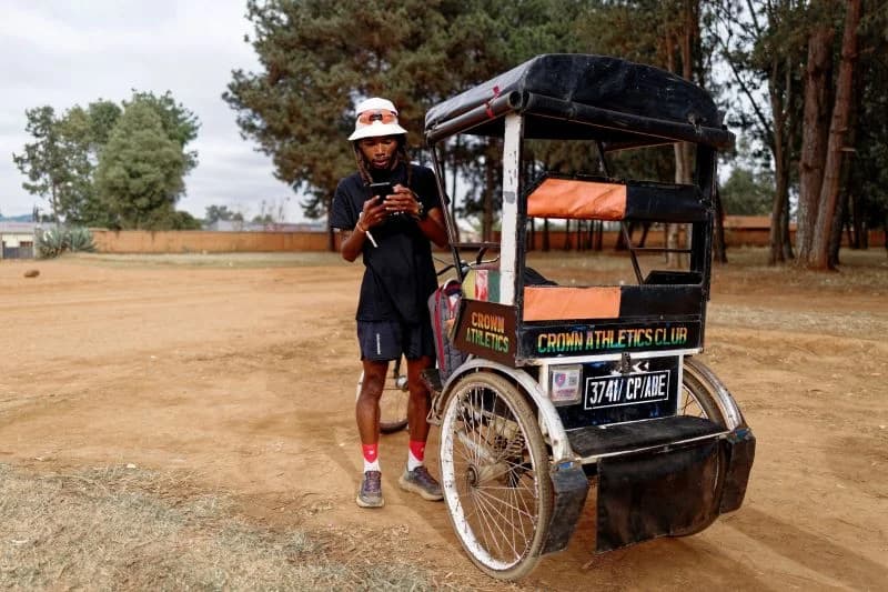Runner beside a cycle rickshaw in Madagascar