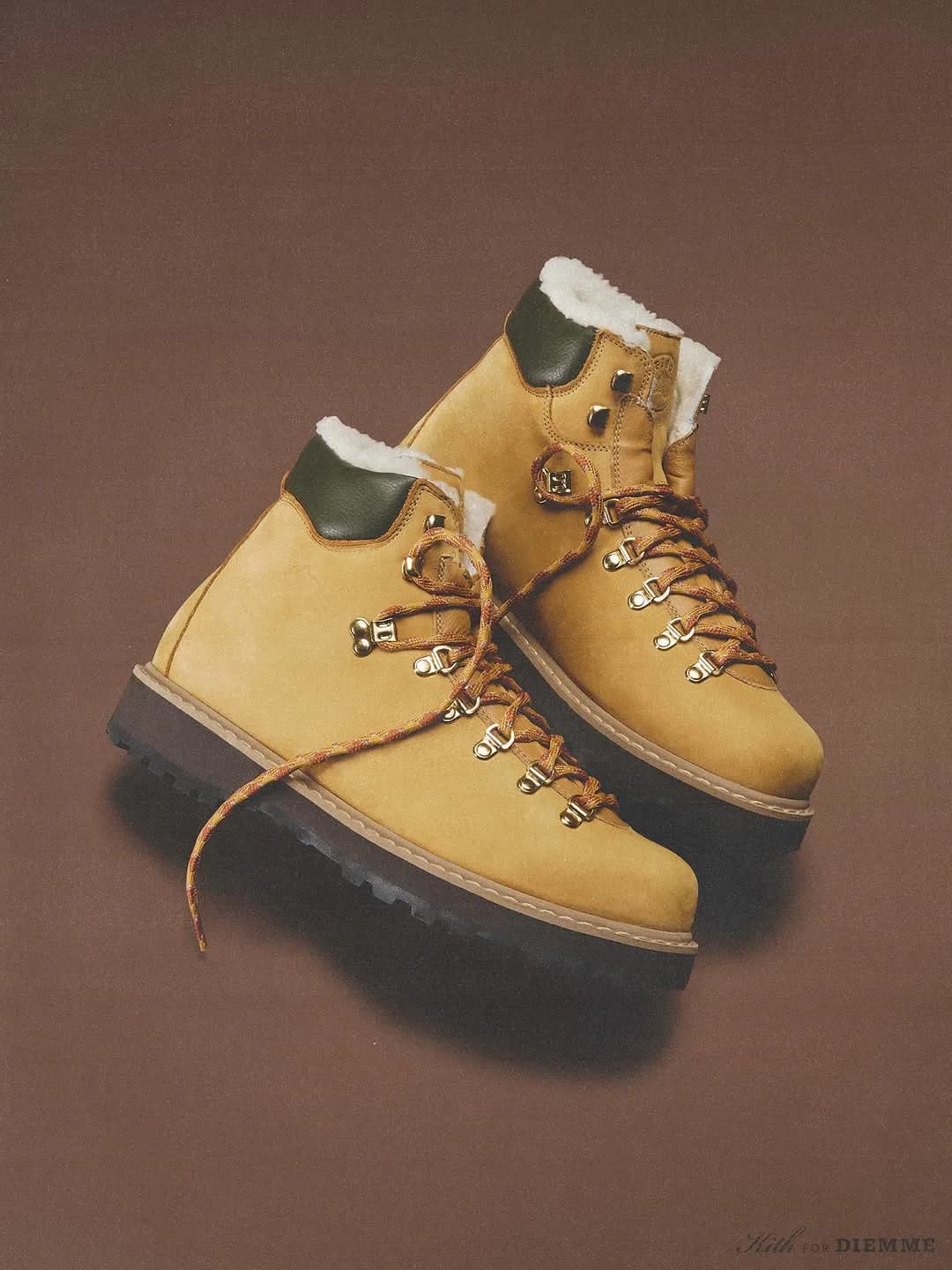 Pair of tan leather Kith x Diemme hiking boots in an angled product shot