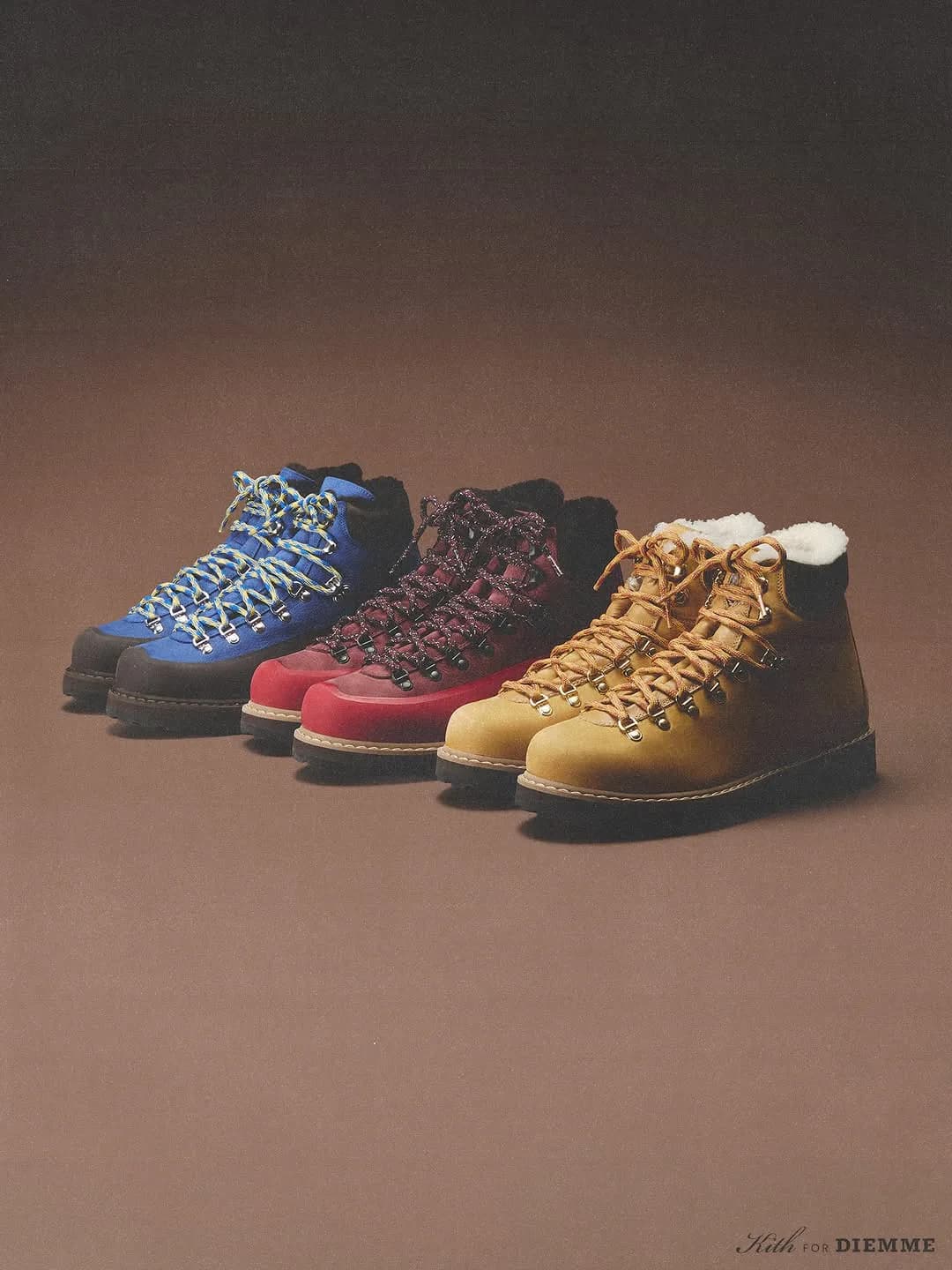 Blue, burgundy, and tan Kith x Diemme hiking boots in a row