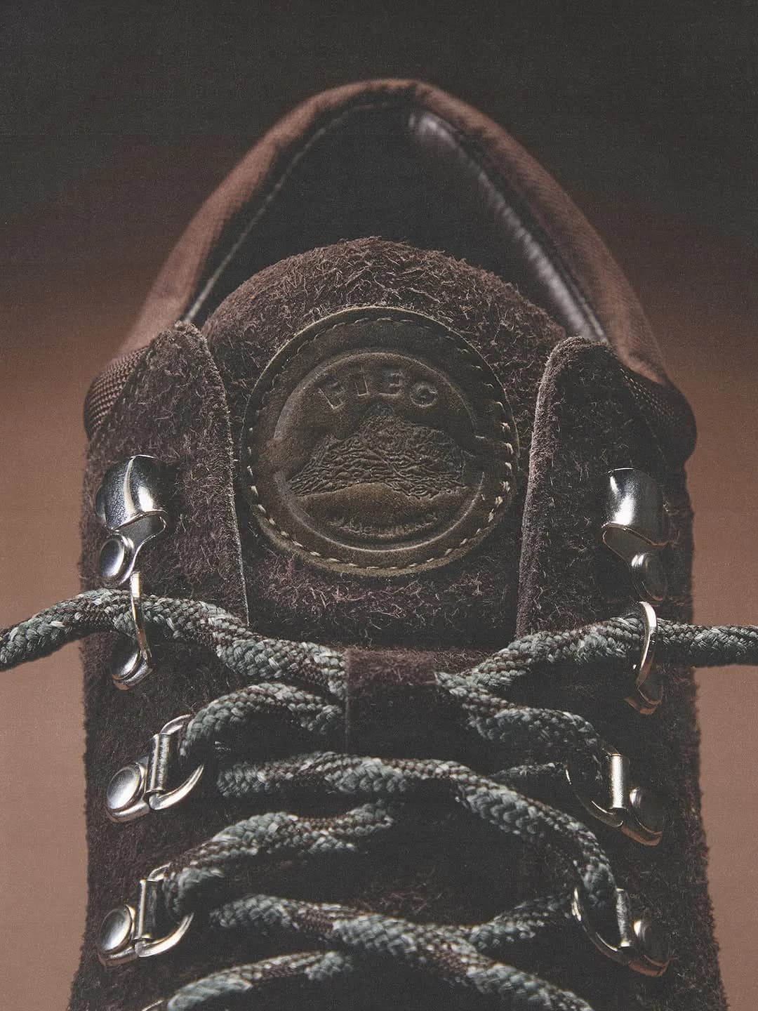 Close-up of a brown Kith x Diemme shoe tongue, laces, and metal eyelets