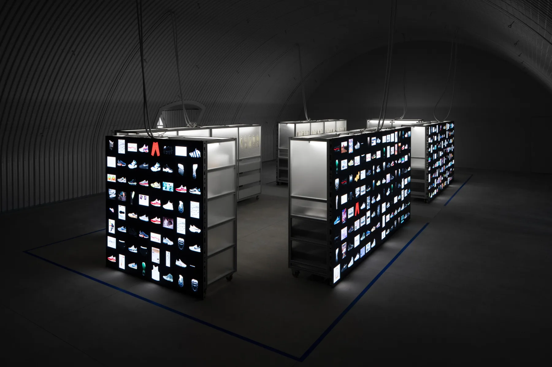 Illuminated archive shelves filled with Nike Air footwear samples
