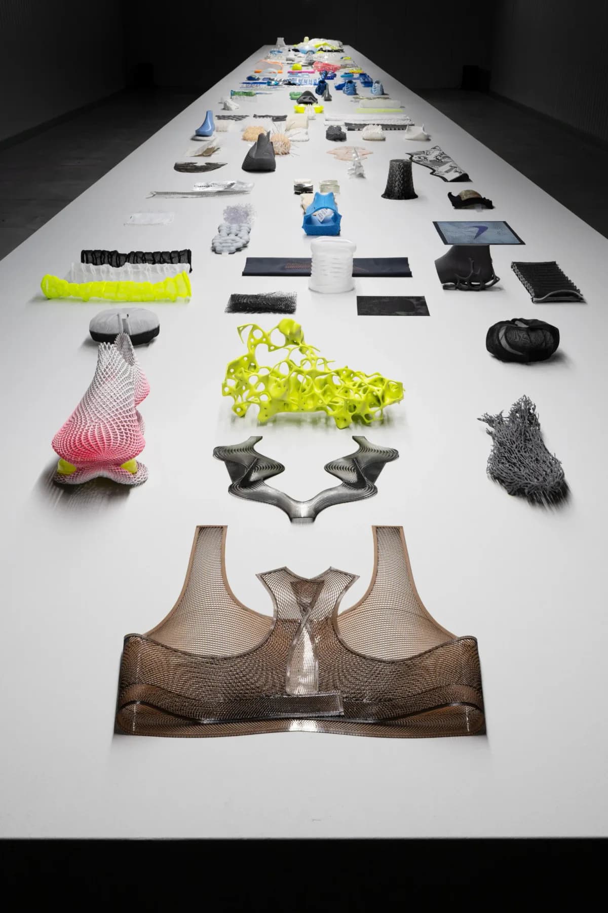 Nike Air prototypes and material samples arranged on a long display table