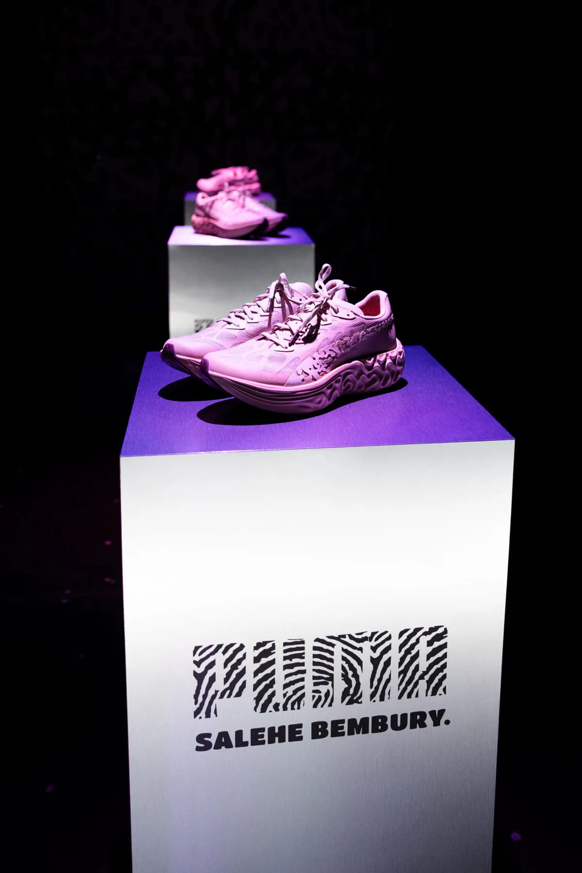 PUMA x Salehe Bembury Velum sneakers displayed under purple lighting