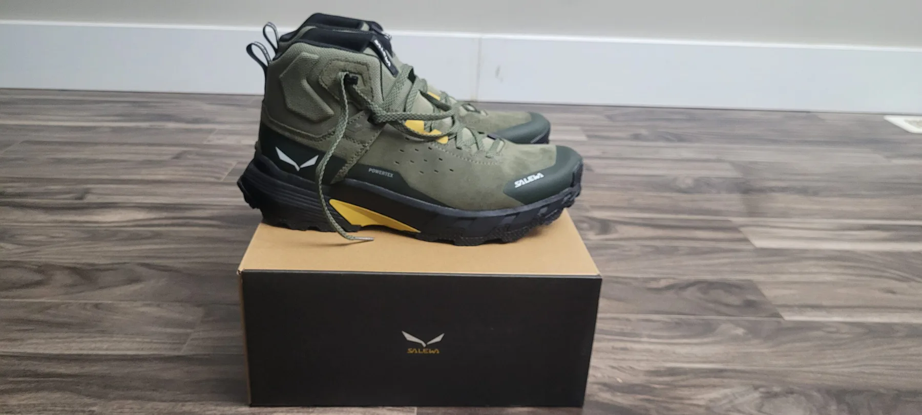 Pair of olive Salewa Pedroc 2 Mid PTX hiking boots on their shoebox