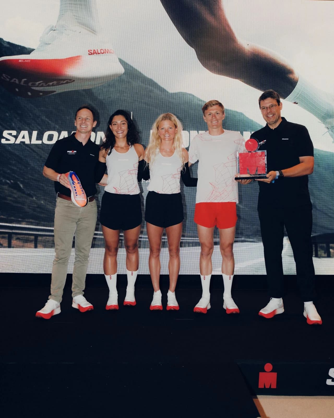 Five participants pose at the Salomon and IRONMAN announcement in Nice.