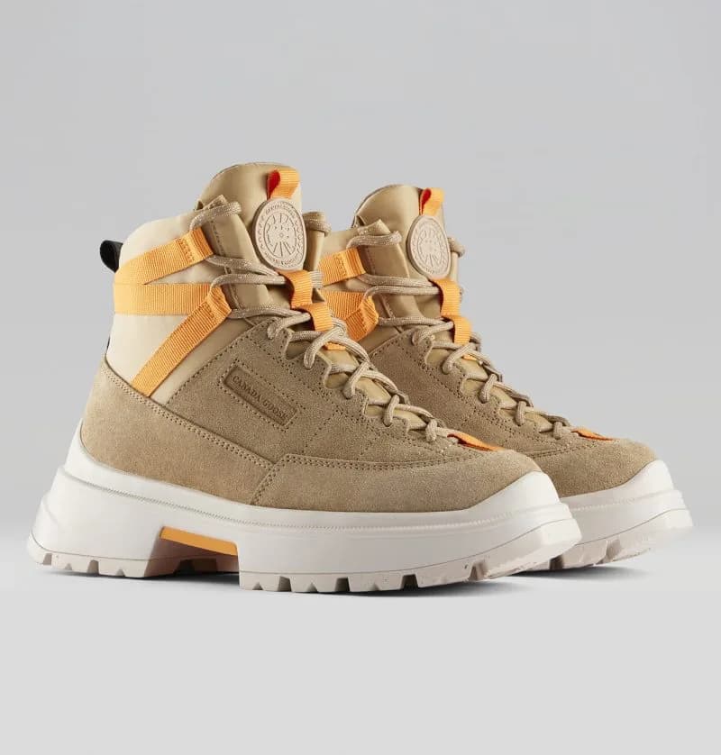 Pair of tan Canada Goose Journey Boot Lite boots with orange webbing