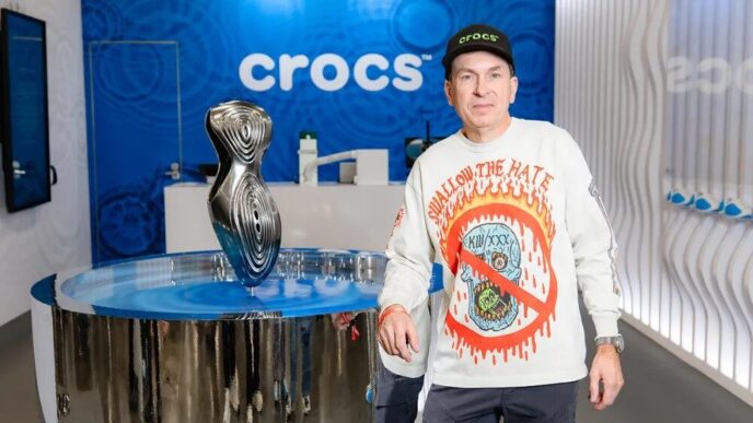Crocs is moving its most watched experiment closer to the mainstream as the Steven Smith, designed Ripple finally gets a broader rollout after two tightly controlled drops in late 2025. The global release is slated for March 2026, positioning the sculptural slip on as a key piece of the brand’s innovation story heading into spring. Steven Smith’s first Crocs statement The Ripple is the first Crocs design by Steven Smith, the industry veteran behind shoes like the New Balance 1500, Reebok InstaPump Fury, and multiple Yeezy models. Now serving as Head of Innovation Design at Crocs, Smith said “The future can be something different but still has that thread of Crocs DNA and where the brand came from, woven into the structure. And maybe we’ll push the design to make it more comfortable or try new foams and new ideas. And maybe it’s even more of a hybrid, where it’s becomes more sneaker like” Early coverage has repeatedly framed the Ripple as Crocs' most anticipated release of the year, reflecting both Smith’s reputation and the way the silhouette repositions Crocs from meme friendly clogs to a more progressive design player. From limited drops to wider release The Ripple debuted in an OG white and blue colorway through small, limited runs that sold out quickly, functioning almost like concept drops to test demand. With those experiments behind it, Crocs is now preparing a wider March 2026 release window, including a restock of the OG pair and additional color executions. Alongside the global push, Crocs has also started seeding new makeups like Lime Burst through focused doors such as the brand’s SoHo store, where the neon accented version landed in February 2026 ahead of any broader launch. Design language and tech cues Visually, the Ripple leans on thick, white base foam with flowing ripples of softer Mellow Foam wrapping the heel, sidewalls, and underfoot, giving the shoe its water inspired name. A TPU shank in the midsole adds stability to the otherwise soft, sculpted unit, suggesting Crocs is thinking about underfoot structure in a more performance adjacent way than on classic clogs. The result is a silhouette that feels closer to the foam led, one piece runners that have dominated the last decade of experimental footwear than to a traditional garden clog, while still sitting firmly in Crocs comfort first universe. What it signals for Crocs’ future Smith has been positioned as a designer from the future, with the Ripple framed as the opening move in a longer pipeline of experimental models at Crocs. The brand has already been building that narrative through projects like the Gallery Shoe and its Kiko Kostadinov work shoe; the Ripple adds a hero form that can headline that innovation tier. A wider Ripple release is a marker of how far Crocs has travelled: from comfort clog disruptor to a company willing to put serious design capital behind sculptural foam silhouettes, competing for attention with the same dad shoe godfather who helped shape modern sneaker culture.
