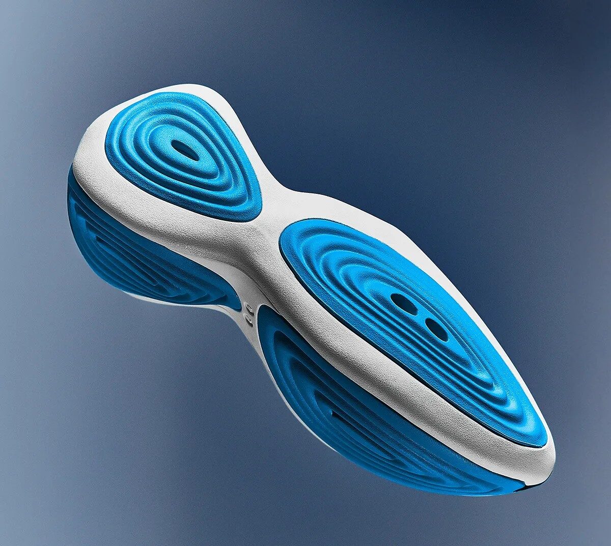 Crocs is moving its most watched experiment closer to the mainstream as the Steven Smith, designed Ripple finally gets a broader rollout after two tightly controlled drops in late 2025. The global release is slated for March 2026, positioning the sculptural slip on as a key piece of the brand’s innovation story heading into spring.Steven Smith’s first Crocs statement The Ripple is the first Crocs design by Steven Smith, the industry veteran behind shoes like the New Balance 1500, Reebok InstaPump Fury, and multiple Yeezy models. Now serving as Head of Innovation Design at Crocs, Smith said “The future can be something different but still has that thread of Crocs DNA and where the brand came from, woven into the structure. And maybe we’ll push the design to make it more comfortable or try new foams and new ideas. And maybe it’s even more of a hybrid, where it’s becomes more sneaker like” Early coverage has repeatedly framed the Ripple as Crocs' most anticipated release of the year, reflecting both Smith’s reputation and the way the silhouette repositions Crocs from meme friendly clogs to a more progressive design player. From limited drops to wider release The Ripple debuted in an OG white and blue colorway through small, limited runs that sold out quickly, functioning almost like concept drops to test demand. With those experiments behind it, Crocs is now preparing a wider March 2026 release window, including a restock of the OG pair and additional color executions. Alongside the global push, Crocs has also started seeding new makeups like Lime Burst through focused doors such as the brand’s SoHo store, where the neon accented version landed in February 2026 ahead of any broader launch. Design language and tech cues Visually, the Ripple leans on thick, white base foam with flowing ripples of softer Mellow Foam wrapping the heel, sidewalls, and underfoot, giving the shoe its water inspired name. A TPU shank in the midsole adds stability to the otherwise soft, sculpted unit, suggesting Crocs is thinking about underfoot structure in a more performance adjacent way than on classic clogs. The result is a silhouette that feels closer to the foam led, one piece runners that have dominated the last decade of experimental footwear than to a traditional garden clog, while still sitting firmly in Crocs comfort first universe. What it signals for Crocs’ future Smith has been positioned as a designer from the future, with the Ripple framed as the opening move in a longer pipeline of experimental models at Crocs. The brand has already been building that narrative through projects like the Gallery Shoe and its Kiko Kostadinov work shoe; the Ripple adds a hero form that can headline that innovation tier. A wider Ripple release is a marker of how far Crocs has travelled: from comfort clog disruptor to a company willing to put serious design capital behind sculptural foam silhouettes, competing for attention with the same dad shoe godfather who helped shape modern sneaker culture.